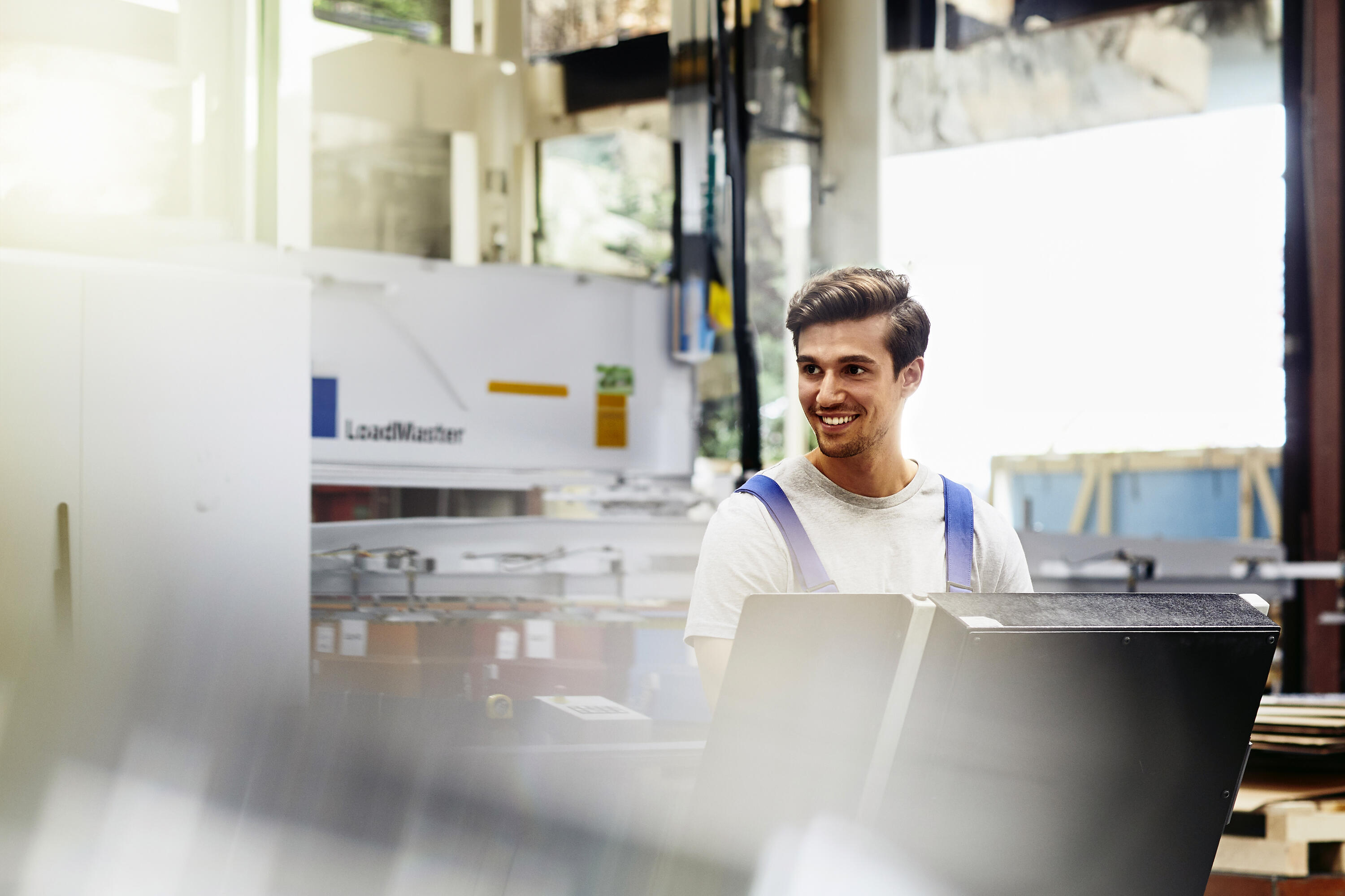 Smiling male on a production site
