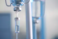 Close up of an IV drip against blurred background.