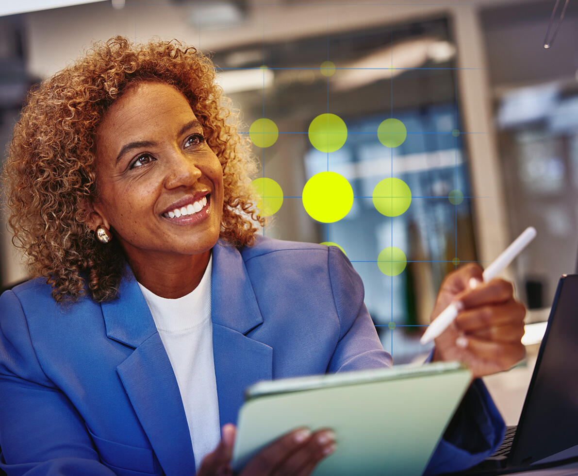 woman smiling at her desk