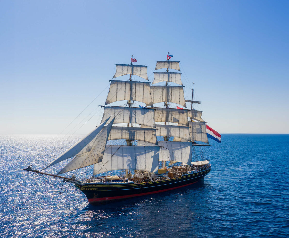 Clipper ship on open sea.