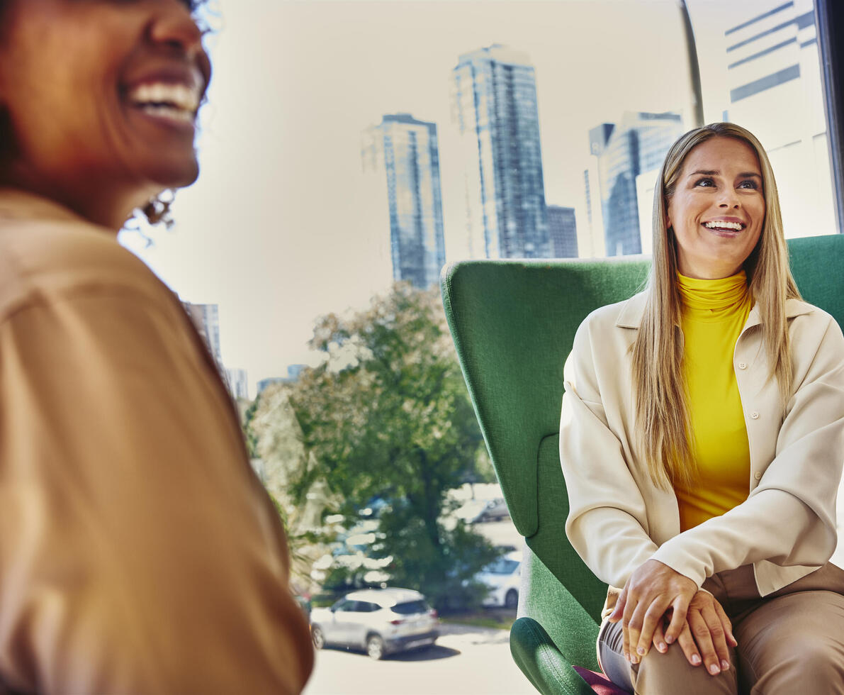 Female sitting in a green chair looking up
