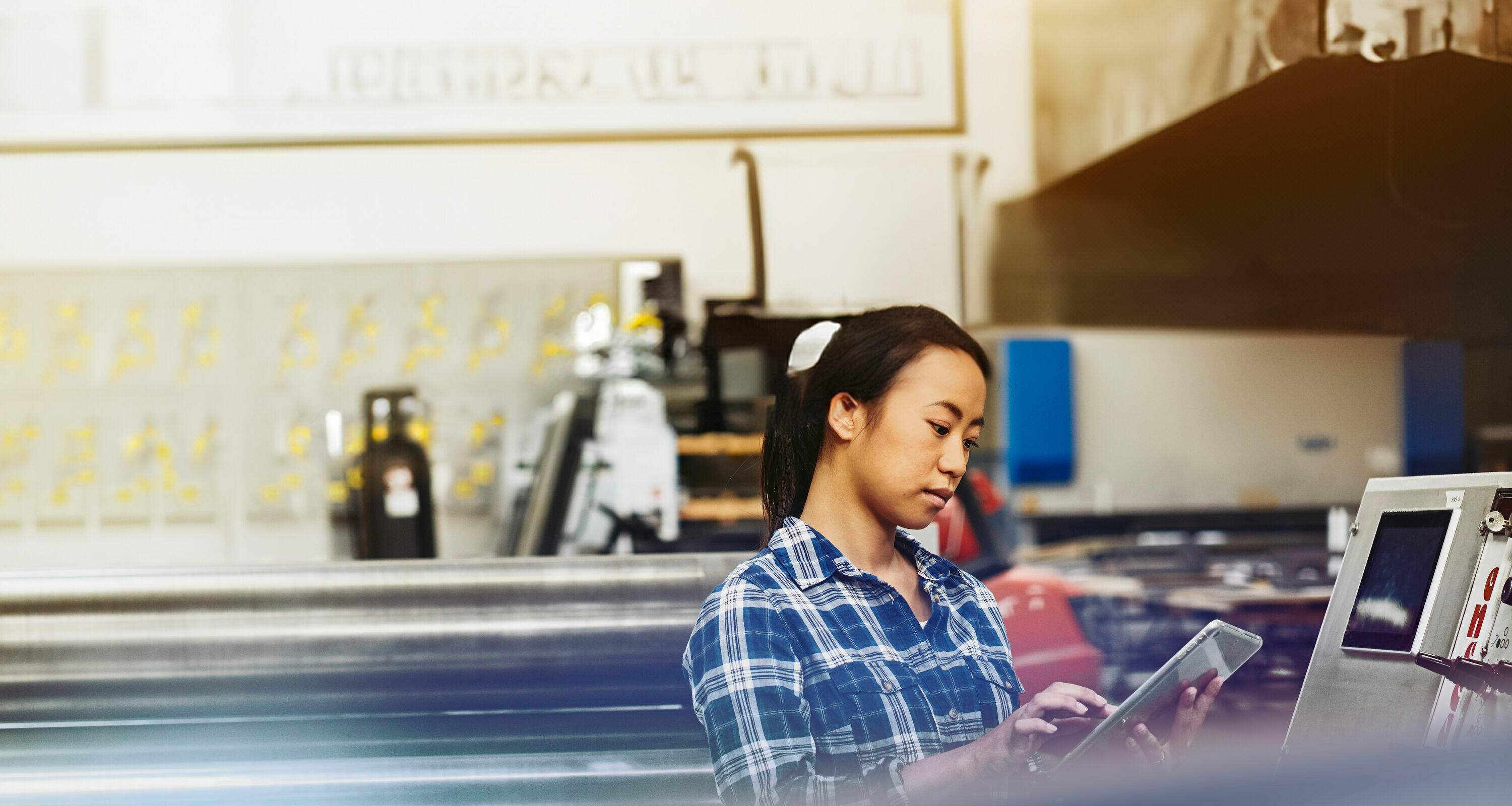 asian lady works on a tablet