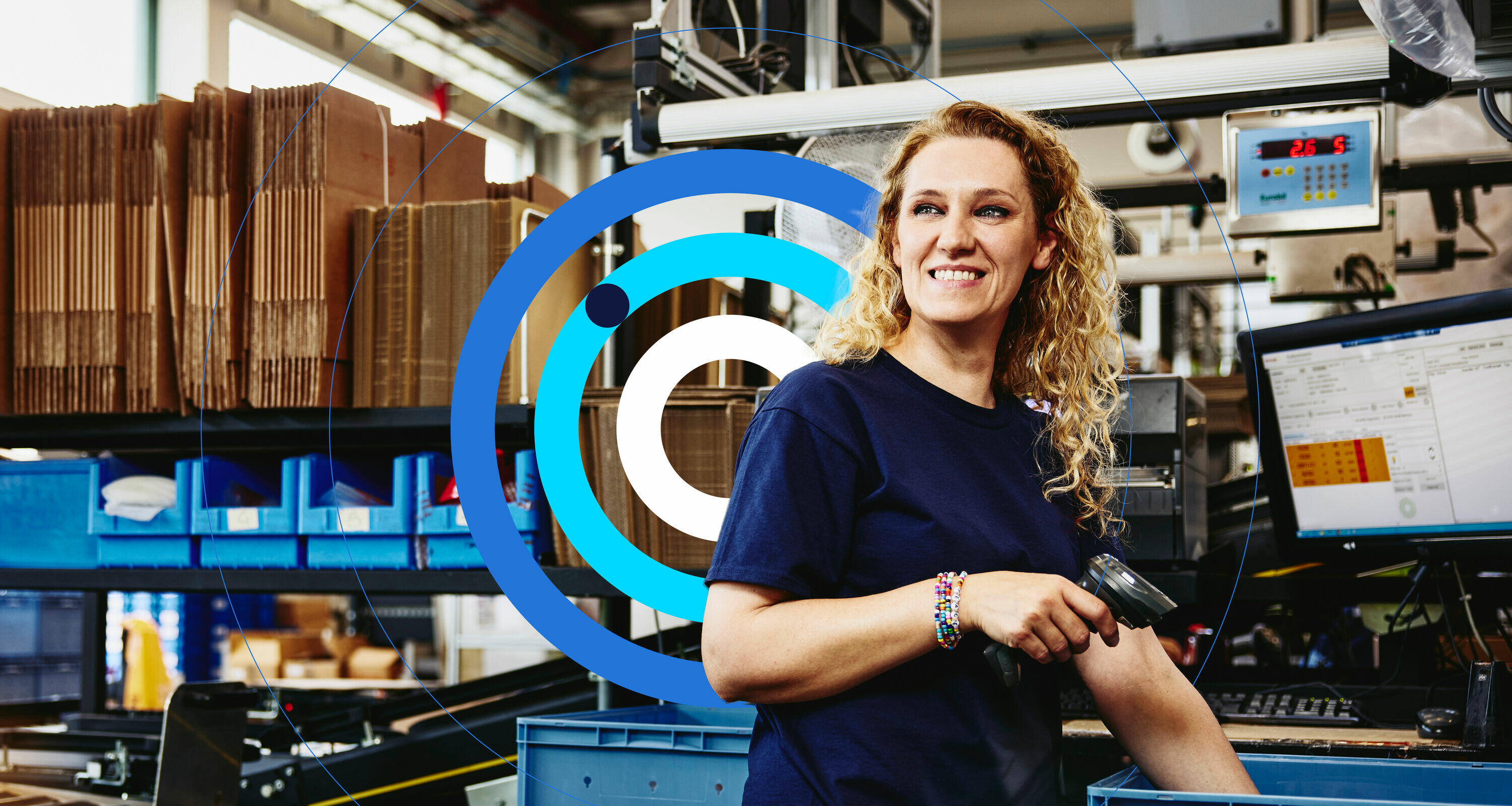 woman smiling working in warehouse on conveyor belt